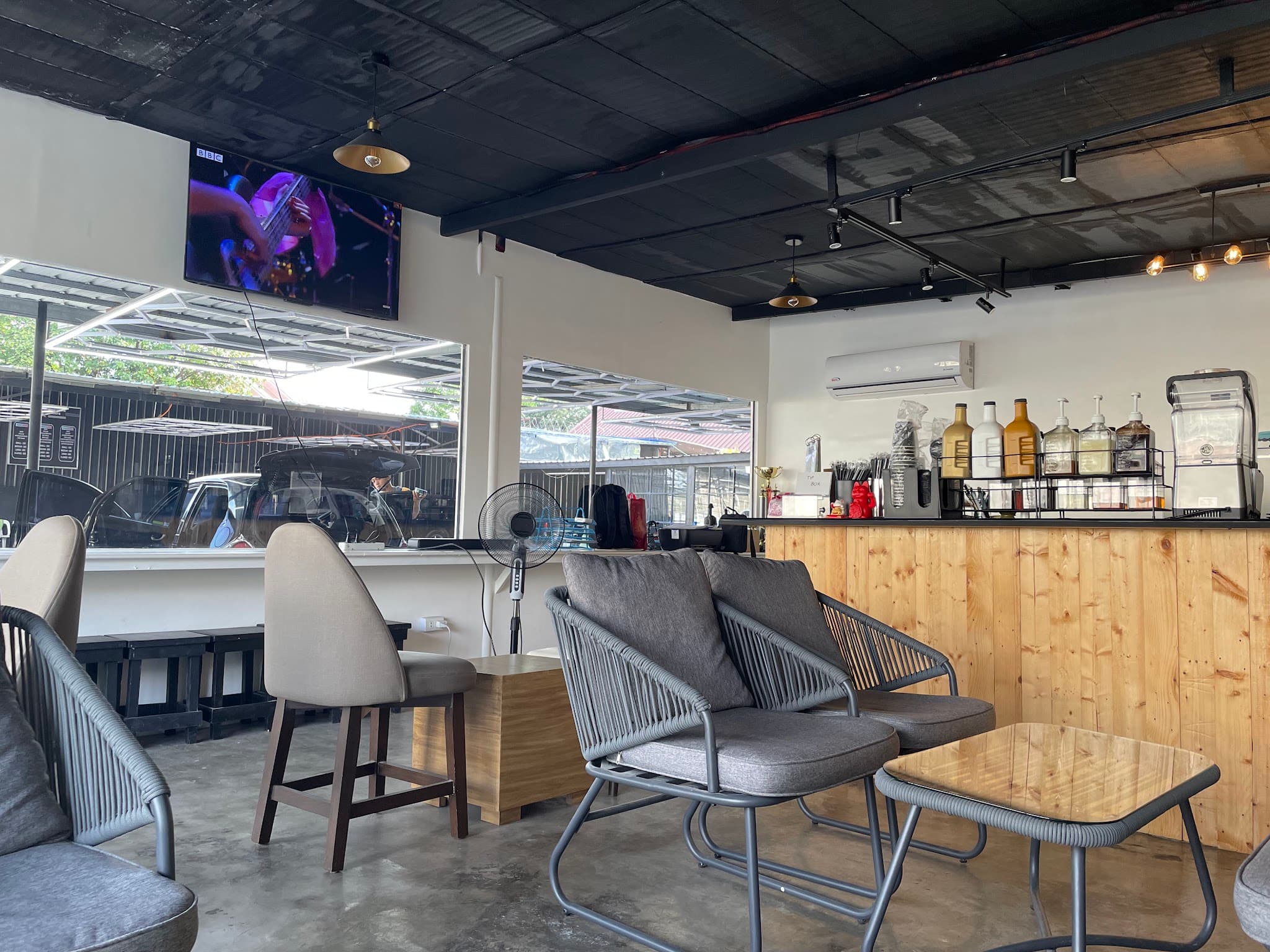 Seating and coffee counter inside RK Auto Spa & Cafe